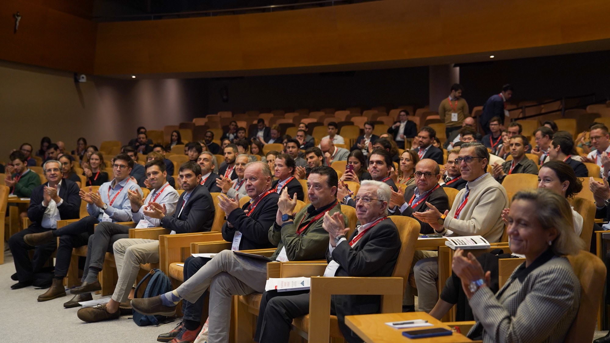 Audience facing the lit IESE letters, 2025 conference